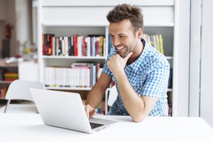 Casual man working on laptop